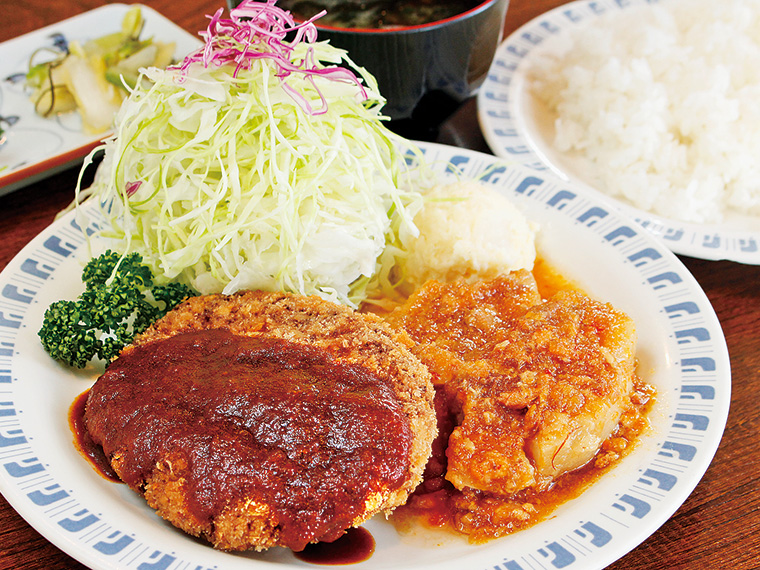 ランチ時、一番人気のセット「コンビメニュー」(1,050円)。9種類のおかずから2種類を選べる。写真はメンチカツと井坂煮。海老のボンマリ、ニンニクステーキの場合は各プラス100円